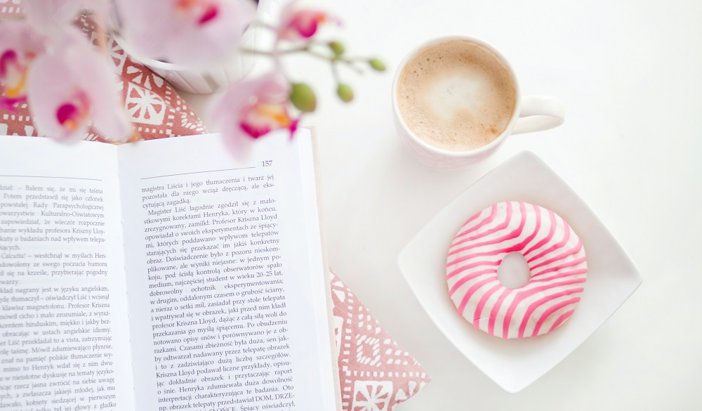 Coffee, a book and a doughnut