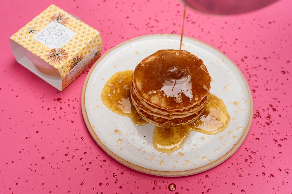 Honey being poured on pancakes - Product photography
