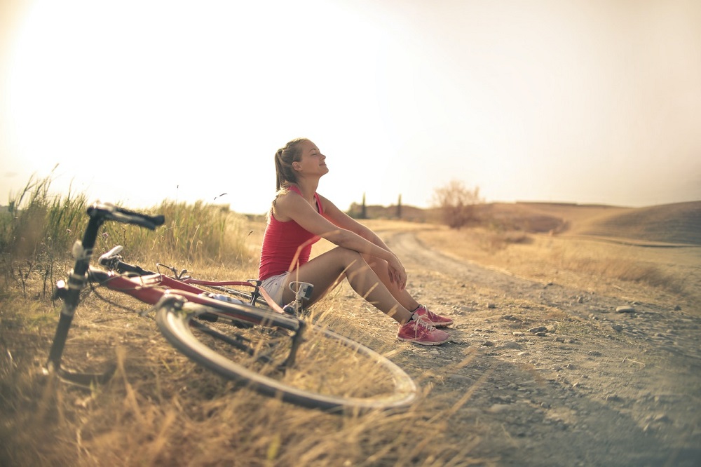 Woman resting on a bike ride Boost eCommerce with product photos