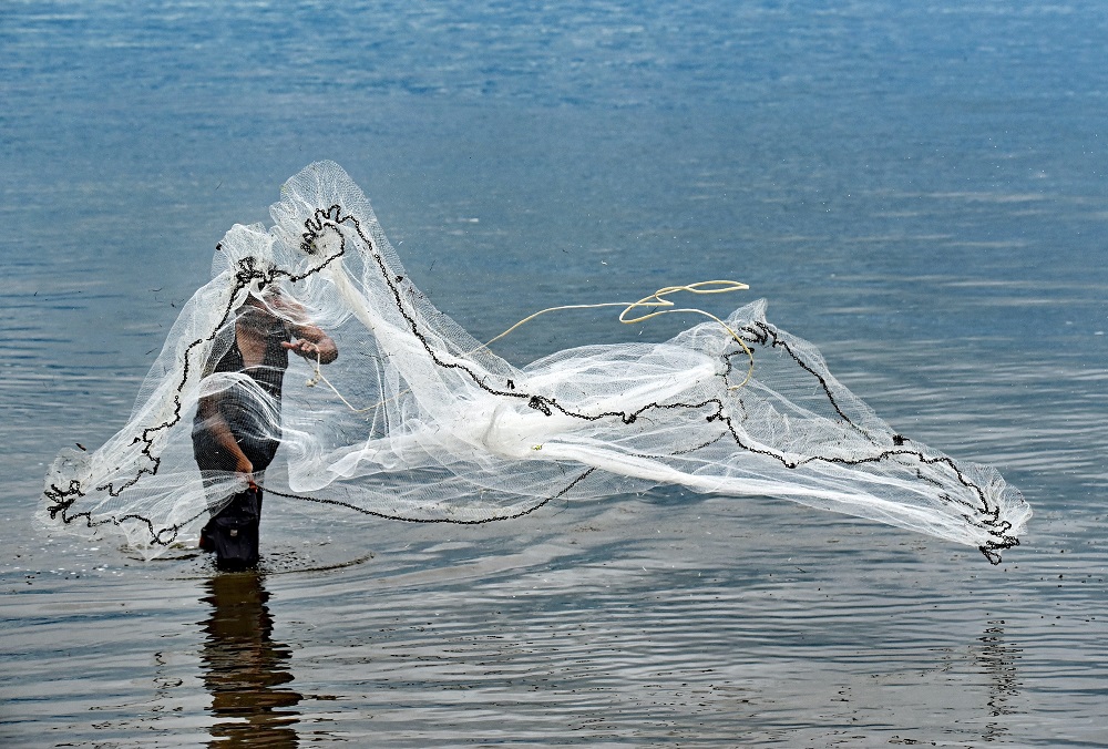 Fisherman casting a net - Designing Content