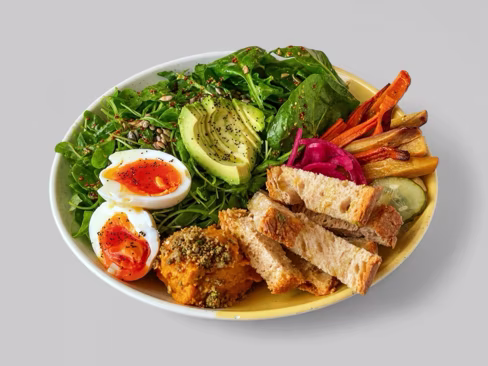 Salad bowl with soft boiled eggs, avocado, roast carrots and sourdough, uploaded by a merchant and edited by Splento
